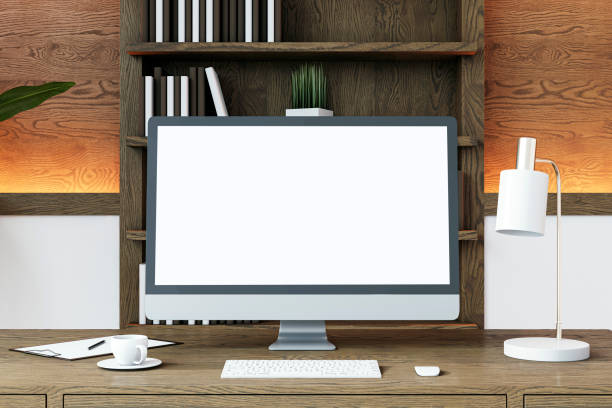 istock Modern home office setup with a desktop computer on a wooden desk. 3D Rendering 2166610366