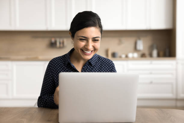 istock Woman using laptop read e-mail, enjoy good news in notification 2166611977