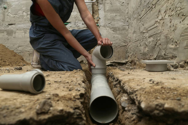 Process of installing PVC pipes sewage system in bathroom, DIY home renovation