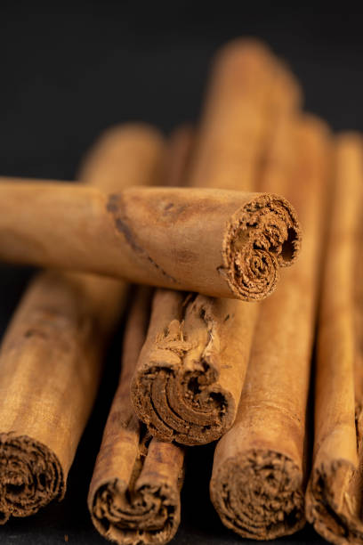 istock Thick wooden cinnamon on a black slate board 2166614177