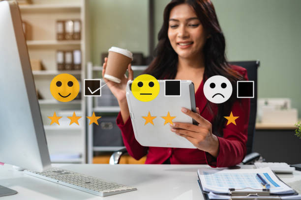 istock Woman holding a digital tablet with checkboxes rating smiley faces excellent for Satisfaction Survey, Happy Client Customer Experience concept. 2166614415
