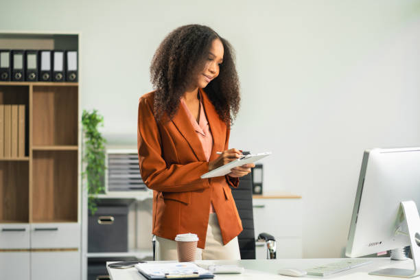 istock Businesswomen hand working with tablet and laptop computer. 2166614427