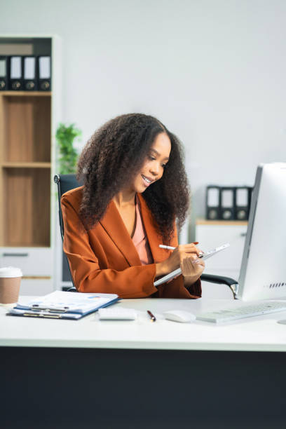 istock Businesswomen hand working with tablet and laptop computer. 2166614454