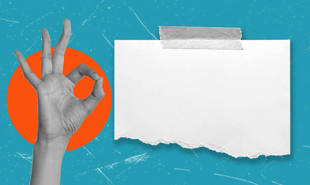 istock Hand gesture signaling approval with a blank paper on a vibrant blue background 2166617242