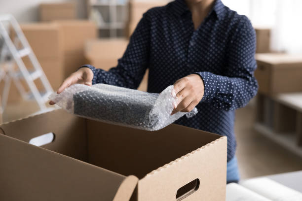 istock Female merchant preparing goods for dispatch, closeup 2166620003