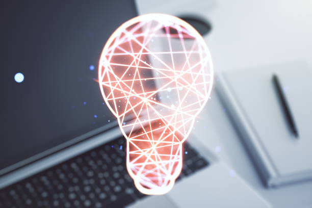 istock Creative light bulb hologram on modern laptop background, idea concept. Multiexposure 2166620109