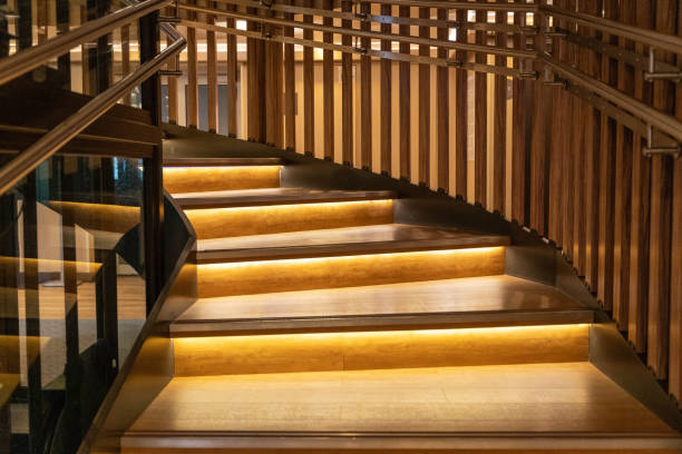 A beautifully designed wooden staircase illuminated by soft lights