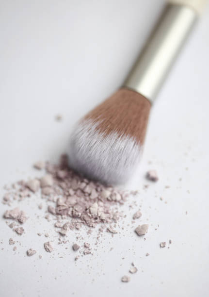 macro shot of make up brush bristle on blue background. Make up accessory