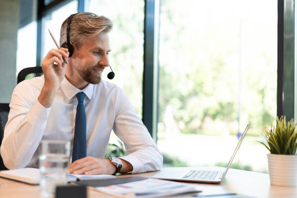 istock Happy young male customer support executive working in office. 2166621334