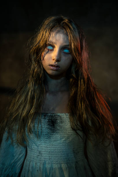Horrifying image of a possessed girl with white eyes. Halloween theme.