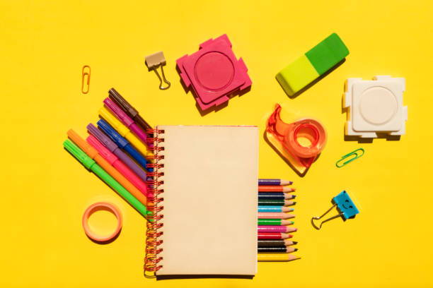 School supplies on yellow background