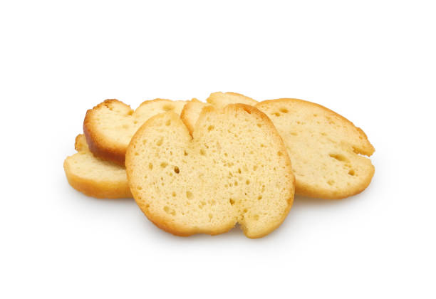 istock Wheat baguette croutons or bruschetta isolated on white 2166623963