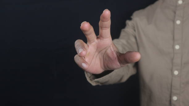 istock Men hands on dark empty for business or technology background. 2166629593