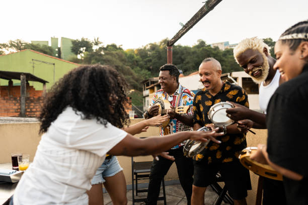 istock Friends playing instruments on rooftop party 2166630125