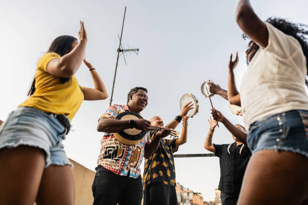 istock Friends playing instruments on rooftop party 2166630131