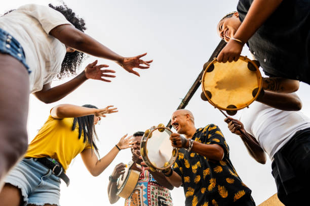 istock Friends playing instruments on rooftop party 2166630137