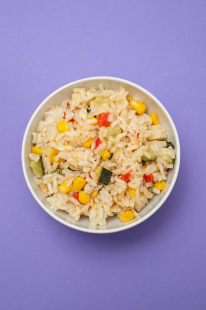 istock Cooked white rice mixed with colorful vegetables 2166630684