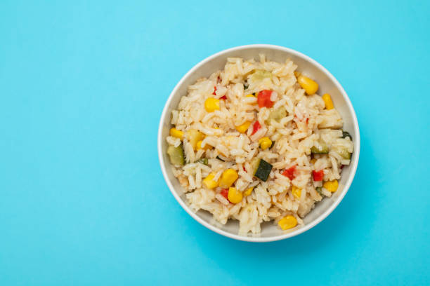 istock Cooked white rice mixed with colorful vegetables 2166630688
