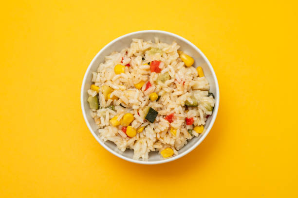 istock Cooked white rice mixed with colorful vegetables 2166630690