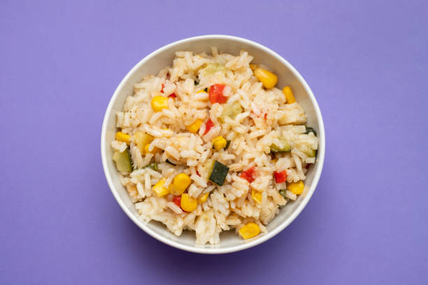istock Cooked white rice mixed with colorful vegetables 2166630695
