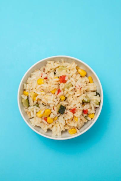 istock Cooked white rice mixed with colorful vegetables 2166630714