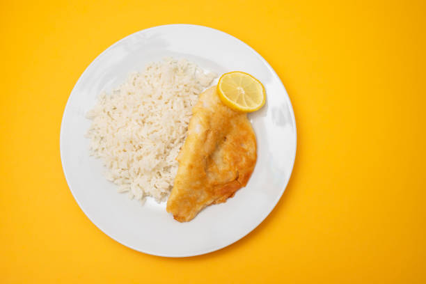 Baked Tilapia in a Lemon, Garlic and Butter Sauce with Green Beans and Rice