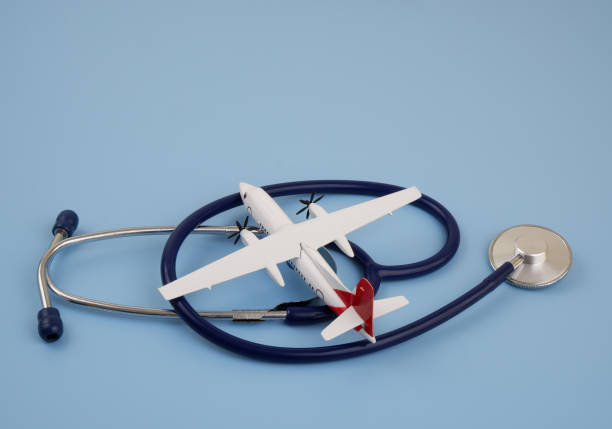 istock Airplane with blue stethoscope on blue background. 2166632594