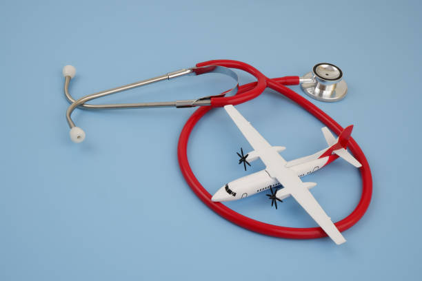 istock Airplane with red stethoscope on blue background. 2166632609