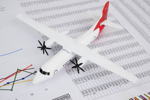 istock Airplane model on financial documents close up. 2166632678