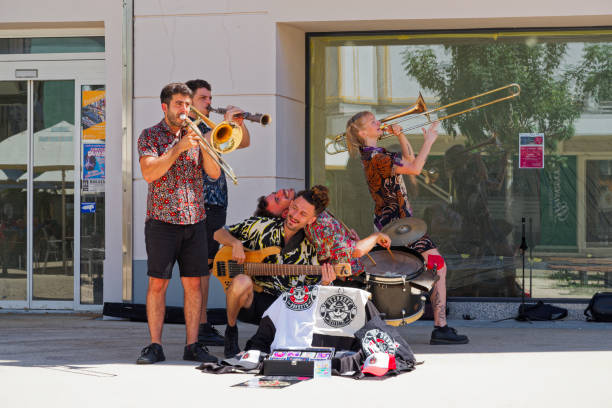 Bregenz, Austria – August 6, 2024: A music group called Desmadre Orkesta having a concert in the center of Bregenz