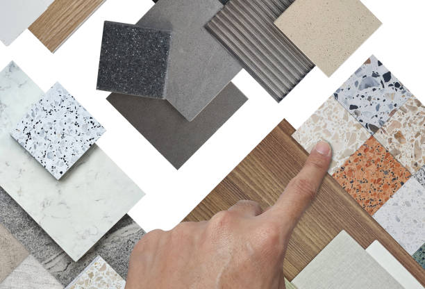 istock architect selects material samples in top view contains terrazzo stones, tiles, wooden laminated, glass, marbles isolated on background with clipping path. 2166636073