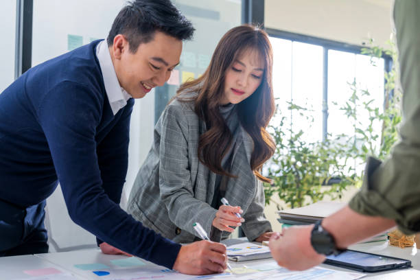 istock Ideas sharing for Business success. Business Development Teamwork start new project status meeting or decision to report, analyze and improve to increases team's overall productivity in a tech busines accountants and finance in office, laptop and strategy 2166639258