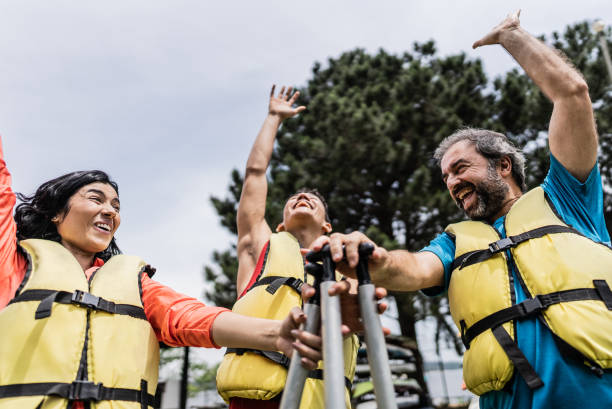 istock Family with clasped hands before canoeing 2166639662