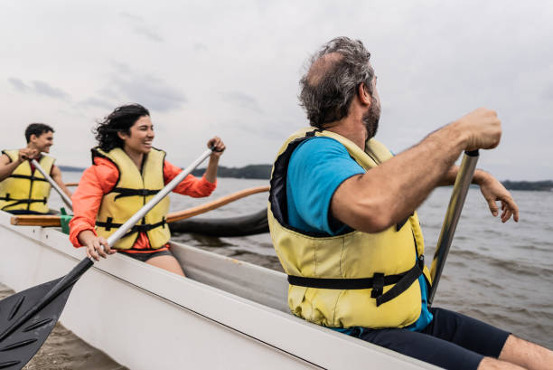 istock Family canoeing in a lake 2166639786