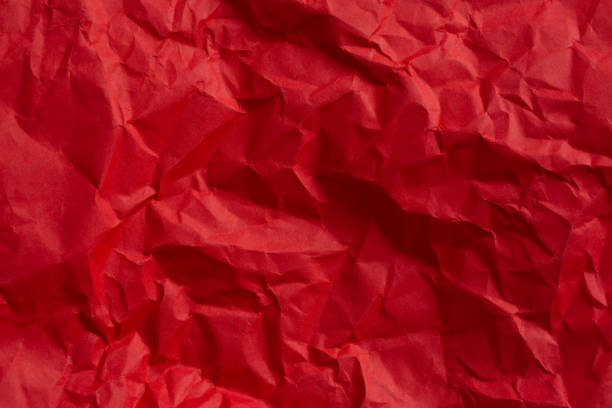 istock Wrinkled red paper texture,Rectangular crumpled sheet of red paper on a white isolated background 2166640198