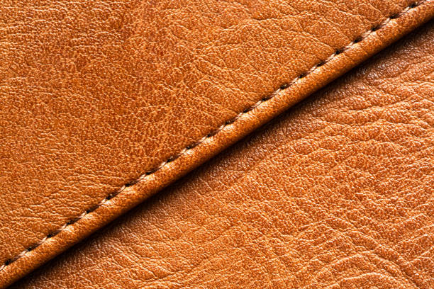 istock Brown macro leather texture,Synthetic leather brown background texture. Brown leather textured background. 2166640249