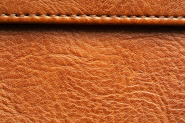 istock Brown macro leather texture,Synthetic leather brown background texture. Brown leather textured background. 2166640269