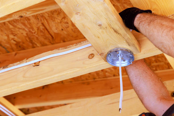 istock Wiring for a ceiling light lamp is mounted by an electrician inside an electrical box 2166640747