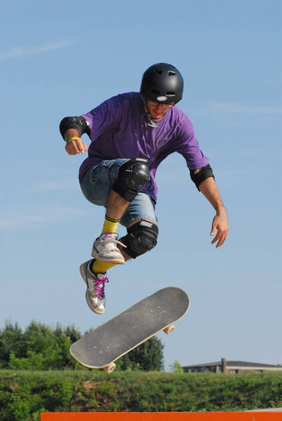 istock Skate boarding boy jump and trick on urban park. 2166640833
