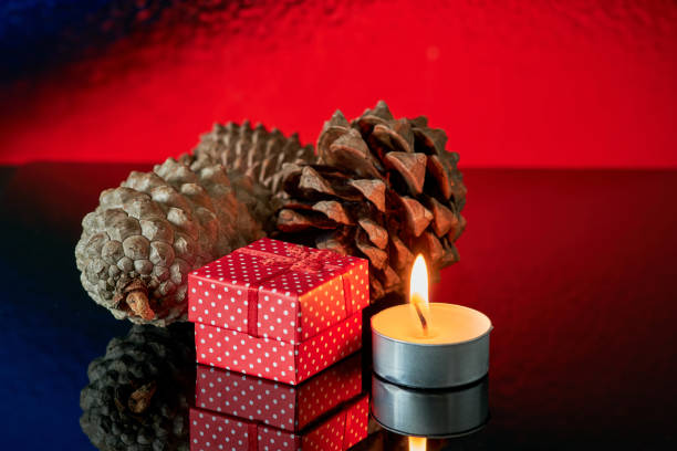 christmas burning candle over on decorative candlestick