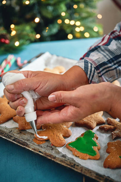 istock Decorating Gingerbread Christmas Cookies with Icing 2166641270
