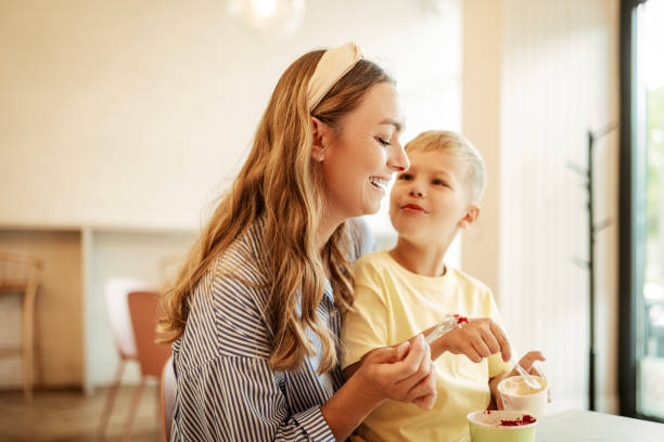 istock Mother and Son Enjoying Ice Cream Together 2166643924