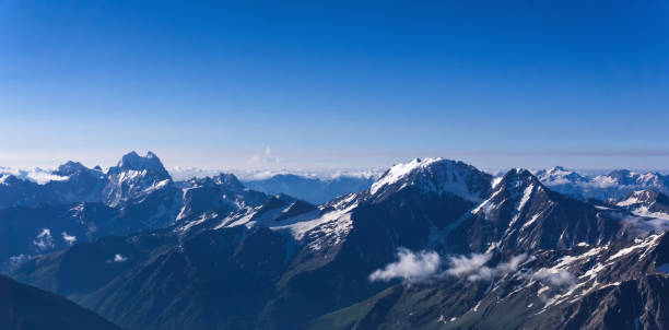 istock panoramic view of snowy high mountain peaks, Caucasus ridge. 2166644041