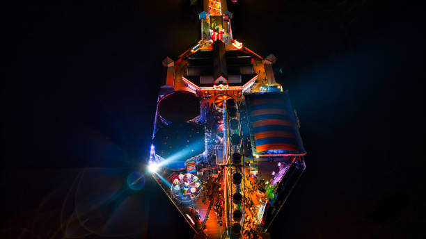 istock Colorful illuminated amusement park ride at night with vibrant lights 2166646461