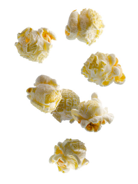 istock Regular classic salted popcorn falls in space. Volumetric light from behind. Popcorn glows from inside. Isolated on white. 2166646491