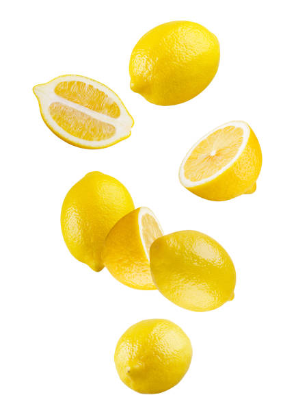 istock Whole and halved lemons form an abstract figure in space. Isolated on white. 2166646493