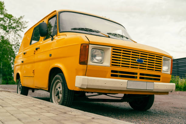 Yellow Renault Toros parked on a cobblestone street in Istanbul, with travel suitcases nearby, creating a nostalgic and authentic atmosphere. Ideal for travel, cultural projects, and storytelling about everyday urban life in Turkey.