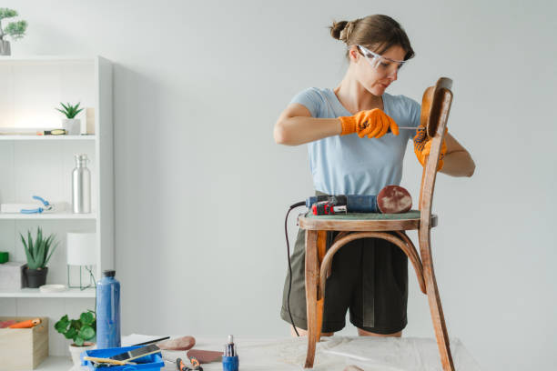 istock Woman using screwdriver repairing chair in workshop 2166649390