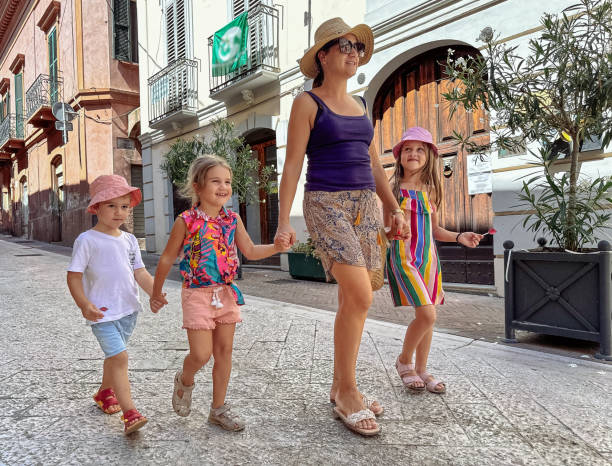 istock Mother with kids visiting old town 2166651414