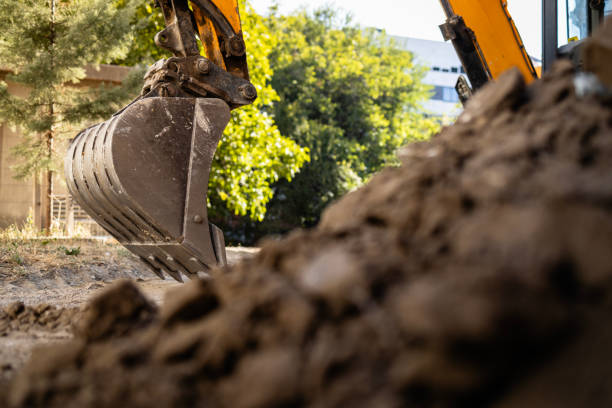 istock Excavator on construction site. Backhoe digging soil for construction business. 2166651462